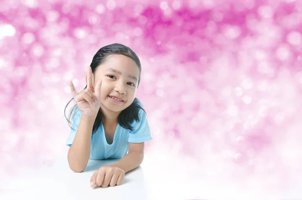 Portait of smile Asian little girl showing  sign of love hand on — Stock Photo, Image