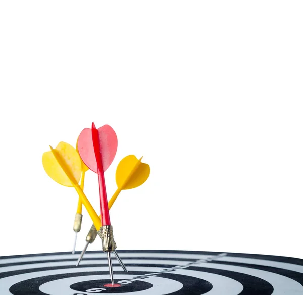 Close up shot red dart arrow on center of dartboard and yellow a — Stock Photo, Image