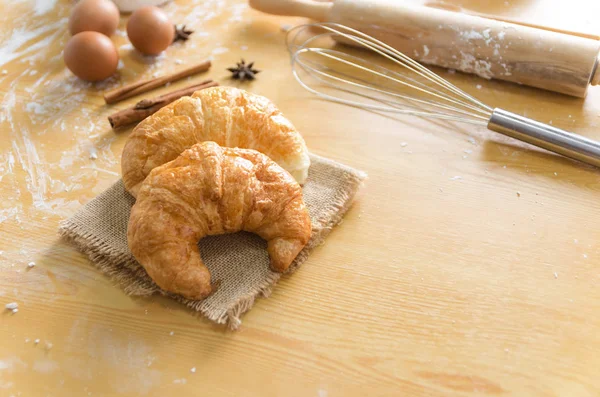 Close up shot of Croissant and bekery ingredients on wooden tabl — Stock Photo, Image