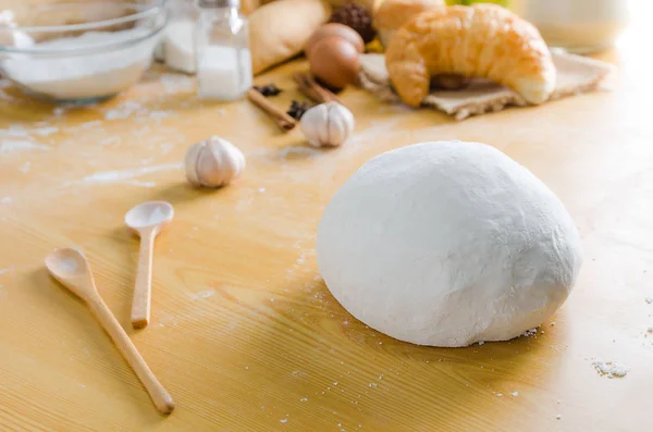 Close up shot of dough with bakery ingredients on wooden table s — Stock Photo, Image
