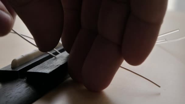 Close Hands Man Replacing Acoustic Classic Guitar Using Nylon Silver — Stock Video