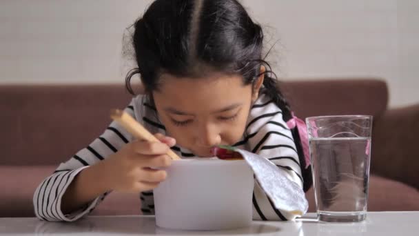 Little Asian Girl Eating Instant Noodle Happiness Select Focus Shallow — Stok Video