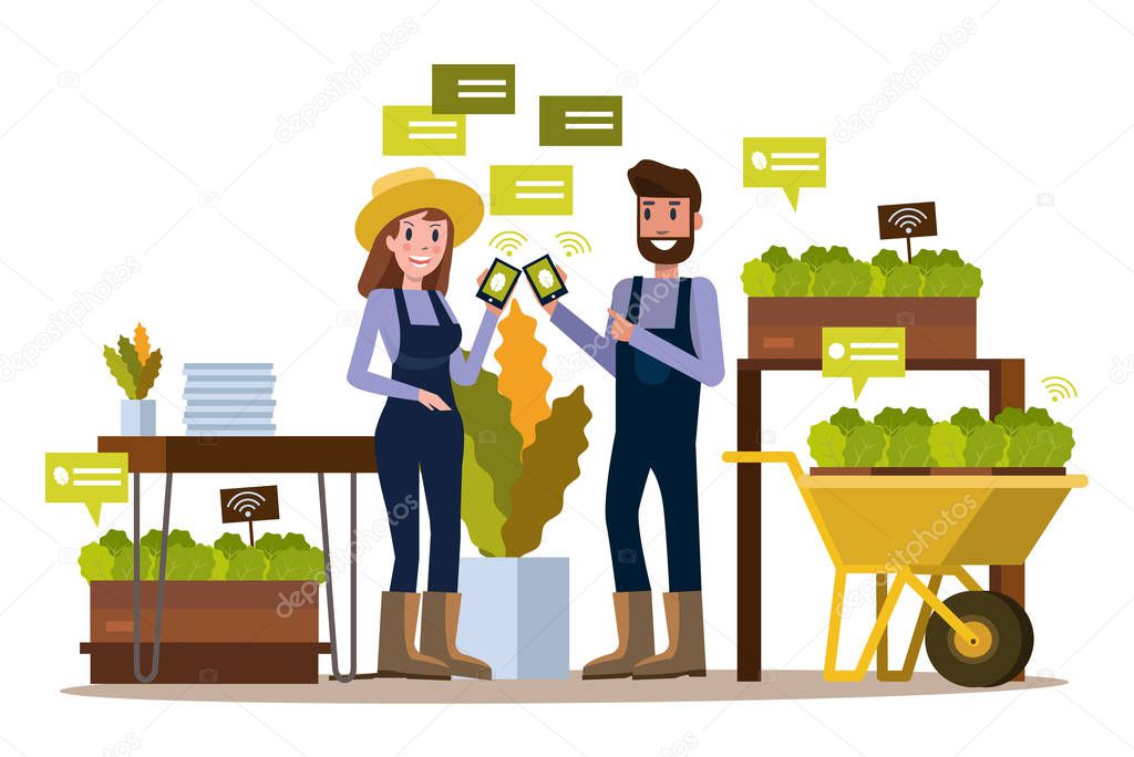 Modern farmer using smartphone  in greenhouse. 