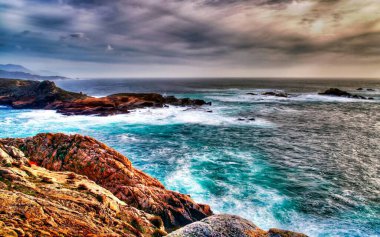 A View Of Sea And Rocks With Sky.