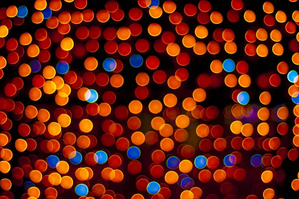Bokeh soyut arkaplanı. Odaklanamayan ışıkların parıltısı.