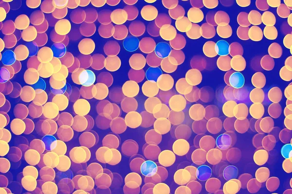 Bokeh soyut arkaplanı. Odaklanamayan ışıkların parıltısı.