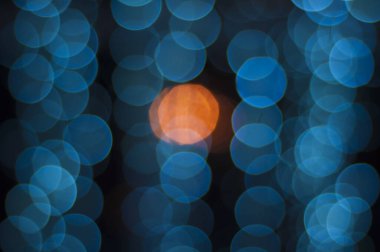 Mavi ve turuncu bokeh soyut arkaplan.