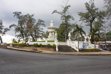 White fountain and road