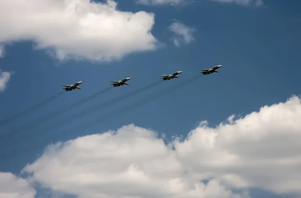 stock image Airplanes fly against the blue sky and white clouds