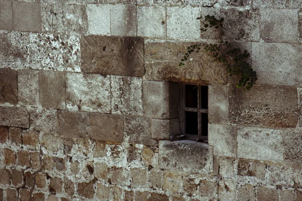 small window in a stone wall