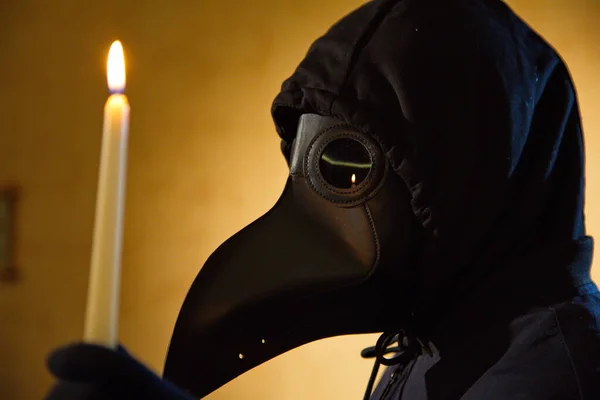 Actress in the mask of the plague doctor.