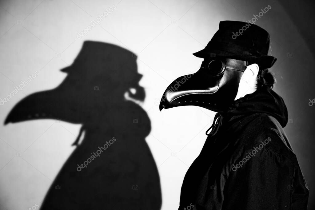 Actress in the mask of the plague doctor.