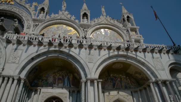 Venice Italy: Basilica di San Marco cathedral church at San Marco or St. Marks square. San Marco basilica architecture. San Marco cathedral pan shot. San Marco close up. San Marco Italy — Stock Video