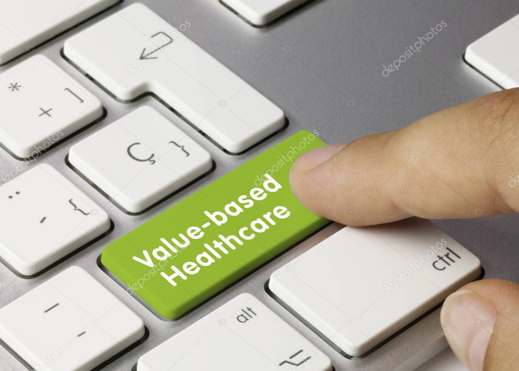 Value-based healthcare - Inscription on Green Keyboard Key. Value-based healthcare Written on Green Key of Metallic Keyboard. Finger pressing key.