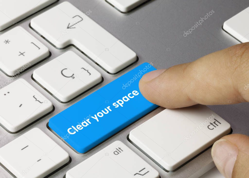 Clear your space - Inscription on Blue Keyboard Key.