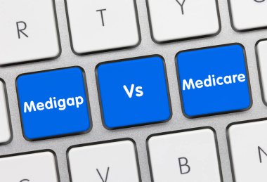 Medigap Vs Medicare - Inscription on Blue Keyboard Key. clipart