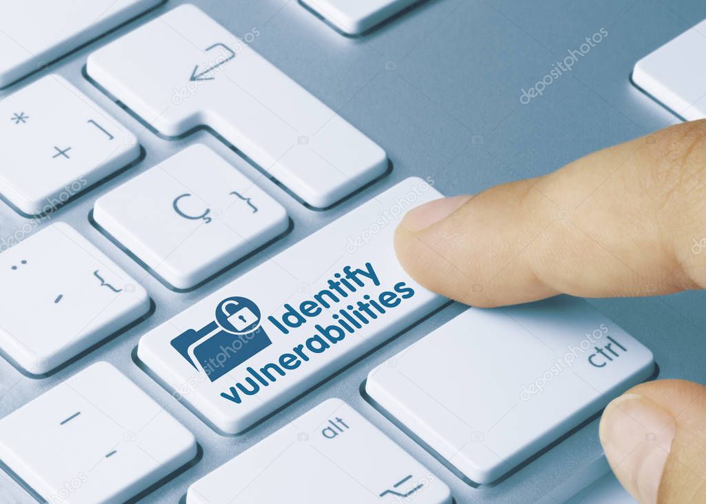 Identify vulnerabilities - Inscription on Blue Keyboard Key.