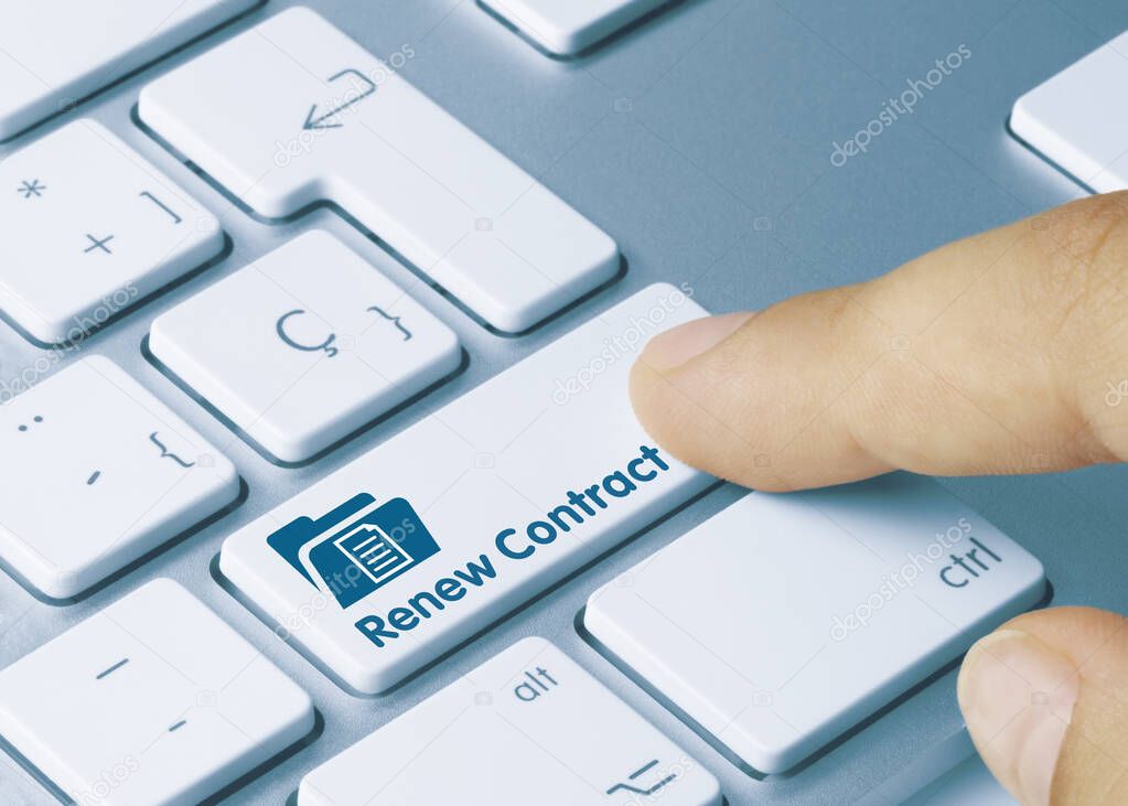 Renew Contract Written on Blue Key of Metallic Keyboard. Finger pressing key.