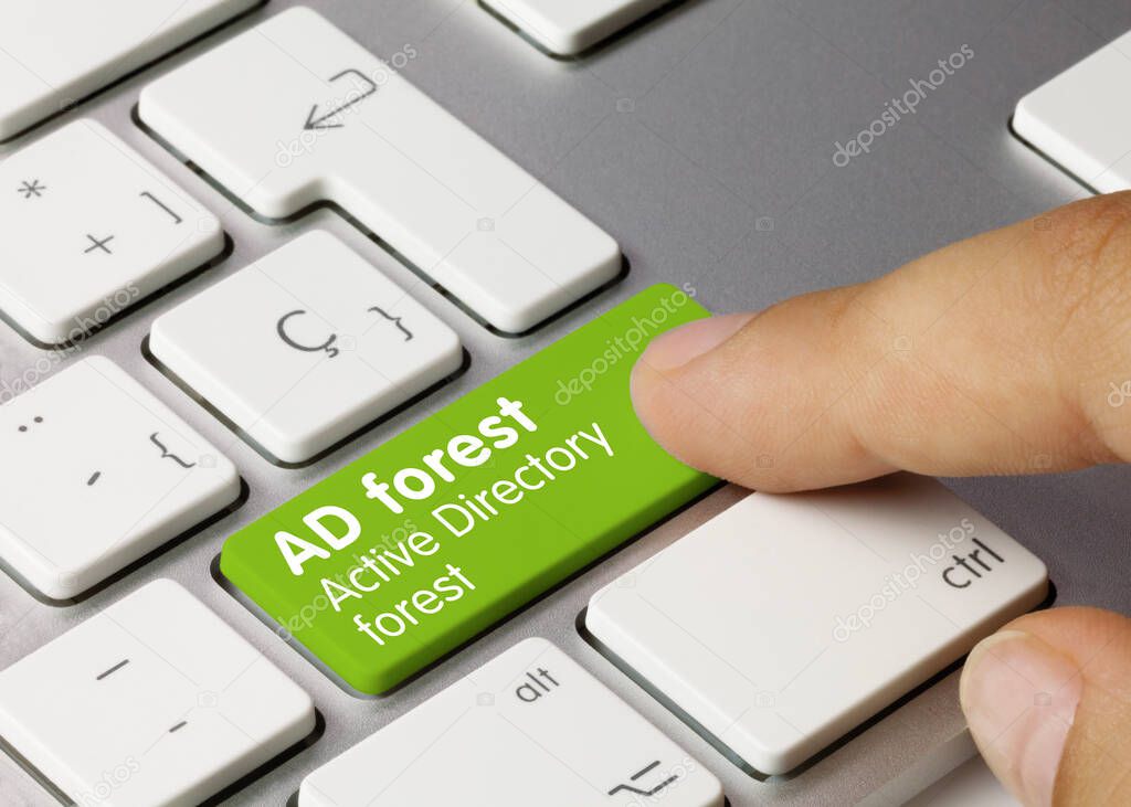 AD forest Active Directory forest Written on Green Key of Metallic Keyboard. Finger pressing key.
