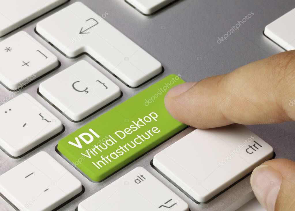 VDI virtual desktop infrastructure Written on Green Key of Metallic Keyboard. Finger pressing key.