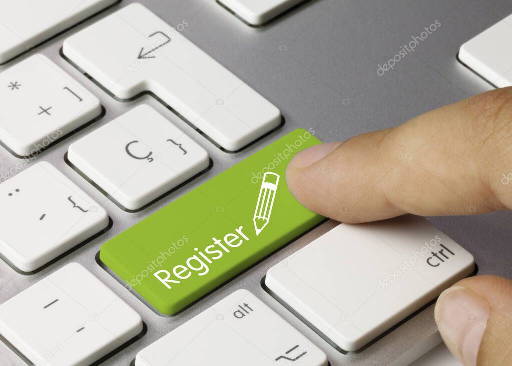 Register Written on Green Key of Metallic Keyboard. Finger pressing key.