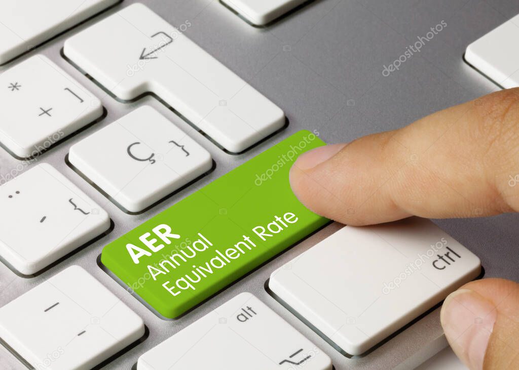 AER Annual equivalent rate Written on Green Key of Metallic Keyboard. Finger pressing key.
