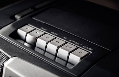 Glasgow, Scotland - January 18, 2020: close-up on the buttons of an old Sony cassette player in black and white.   clipart