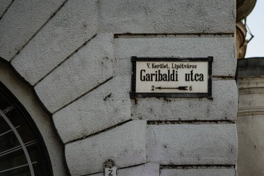 Budapest, Hungary - January 06, 2018: Street name plaque on an old building in downtown Budapest.