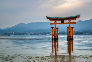 Miyajima, Japan - October 26, 2018: Famous floating torii gate off the coast of the Itsukushima (Mijyajima) Island.