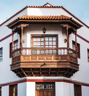 Garachico, Tenerife, Spain - December 18, 2019: Beautiful decorative wooden balconies on a typical Canarian house.