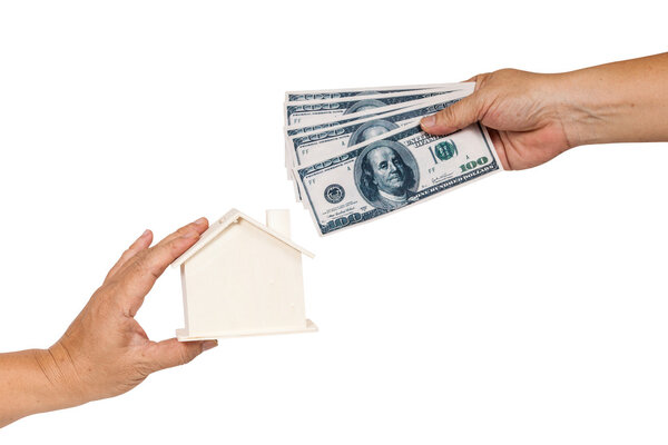 Hand holding house representing home ownership and the 