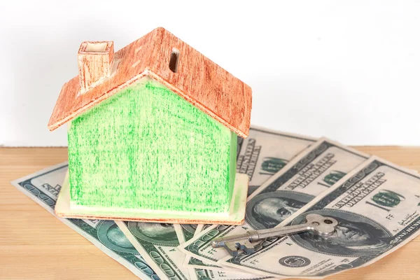 Miniature house with money