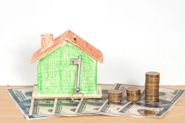 Miniature house with money  to the sale or purchase of Real — Stock fotografie