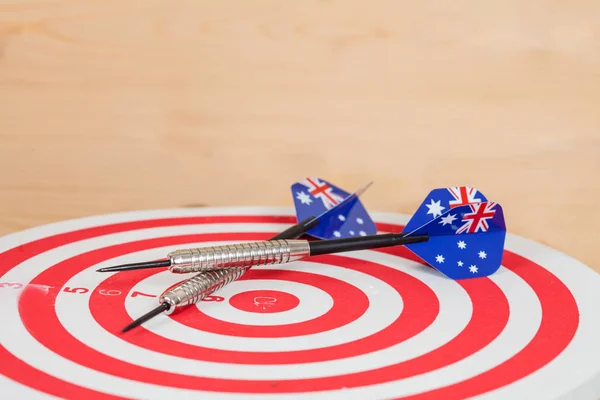 Darts arrow with Australia flags on red dart board ,