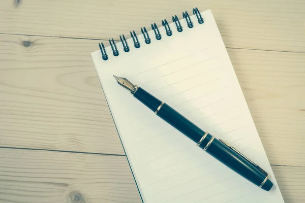 Blank notebook and fountain pen on wooden — Stock Photo, Image