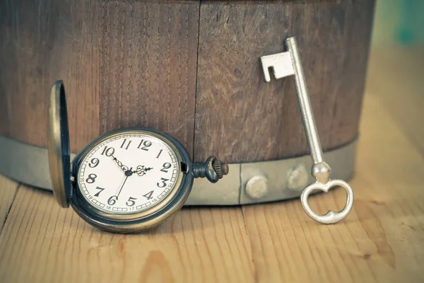 Vintage pocket watch on wooden background — Stock Photo, Image