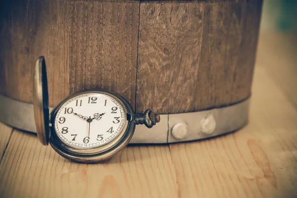 Vintage pocket watch on wooden background — Stock Photo, Image