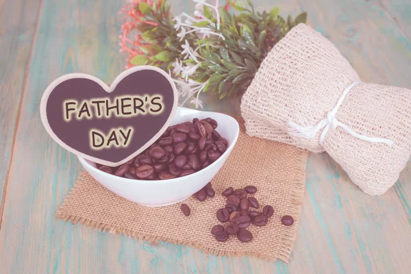 happy father\'s day  heart shape with coffee bean on wooden