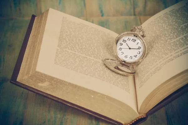 Pocket Watch over Age Book Background ,Time — Stock Photo, Image