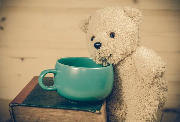 Bear toy with cup of coffee — Stock Photo, Image