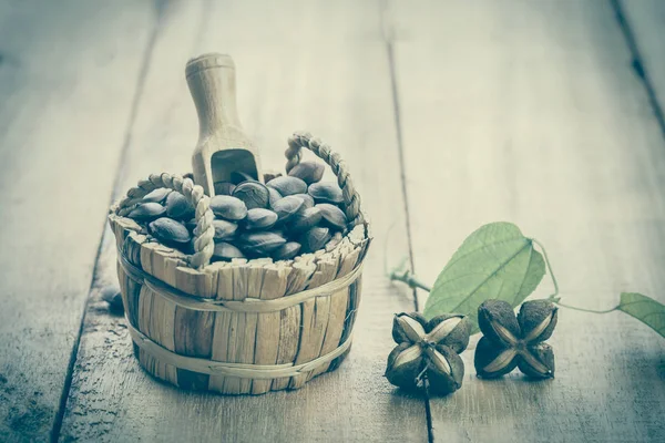 dried capsule seeds fruit of Sacha Inchi peanut in basket