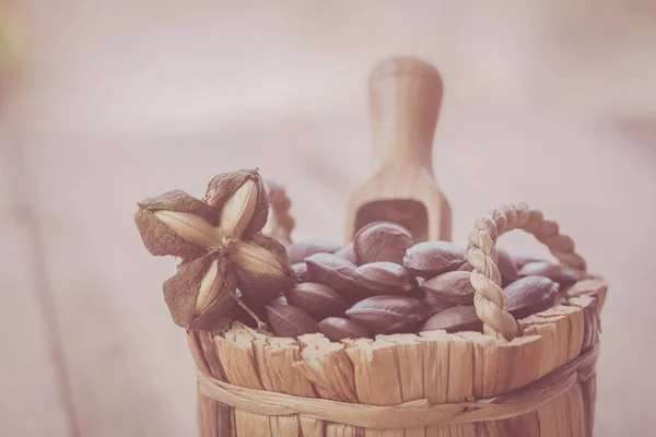 dried capsule seeds fruit of Sacha Inchi peanut in basket