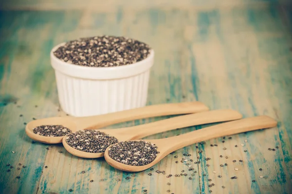 Nutritious chia seeds on a wooden spoon — Stock Photo, Image