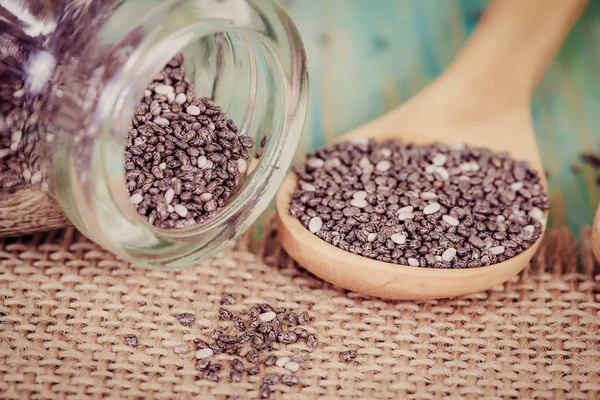 Nutritious chia seeds on a wooden spoon — Stock Photo, Image