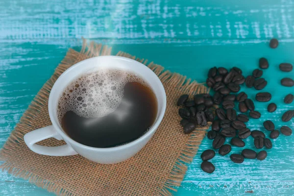 Hot coffee mug on wood — Stock Photo, Image