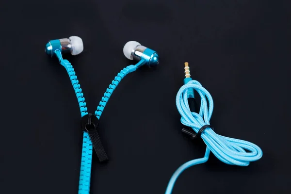 Blue earphone and cable line like zipper — Stock Photo, Image