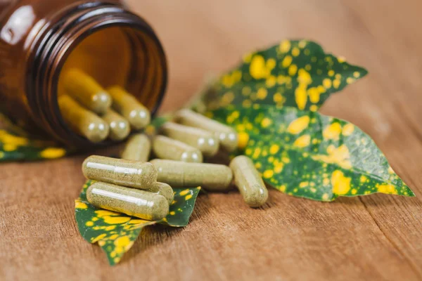 Herbal Medicine Capsules Spilling Out Bottle Soft Focus — Stock Photo, Image