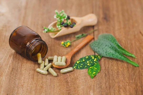 Herbal Medicine Capsules Spilling Out Bottle Soft Focus — Stock Photo, Image