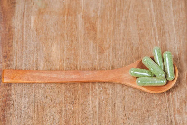 Herbal Medicine Capsules Wooden Spoon Soft Focus — Stock Photo, Image