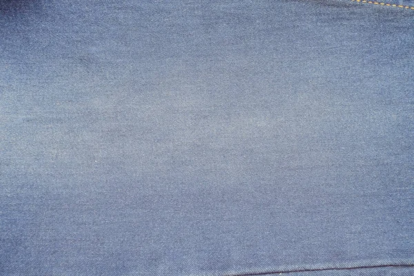 Текстура тканинного фону джинсових джинсів  . — стокове фото